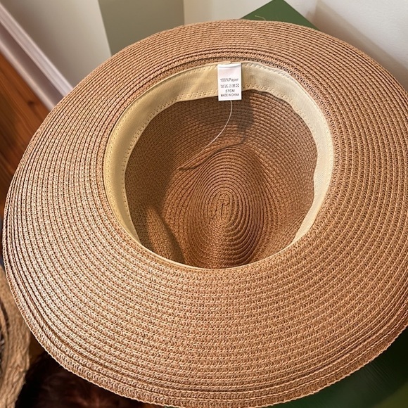 Cowboy hat. It’s tan with a gold shimmer